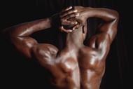 Shrugs work the deltoids and trapezius muscles. (Photo via Pexels/Mike Jones)